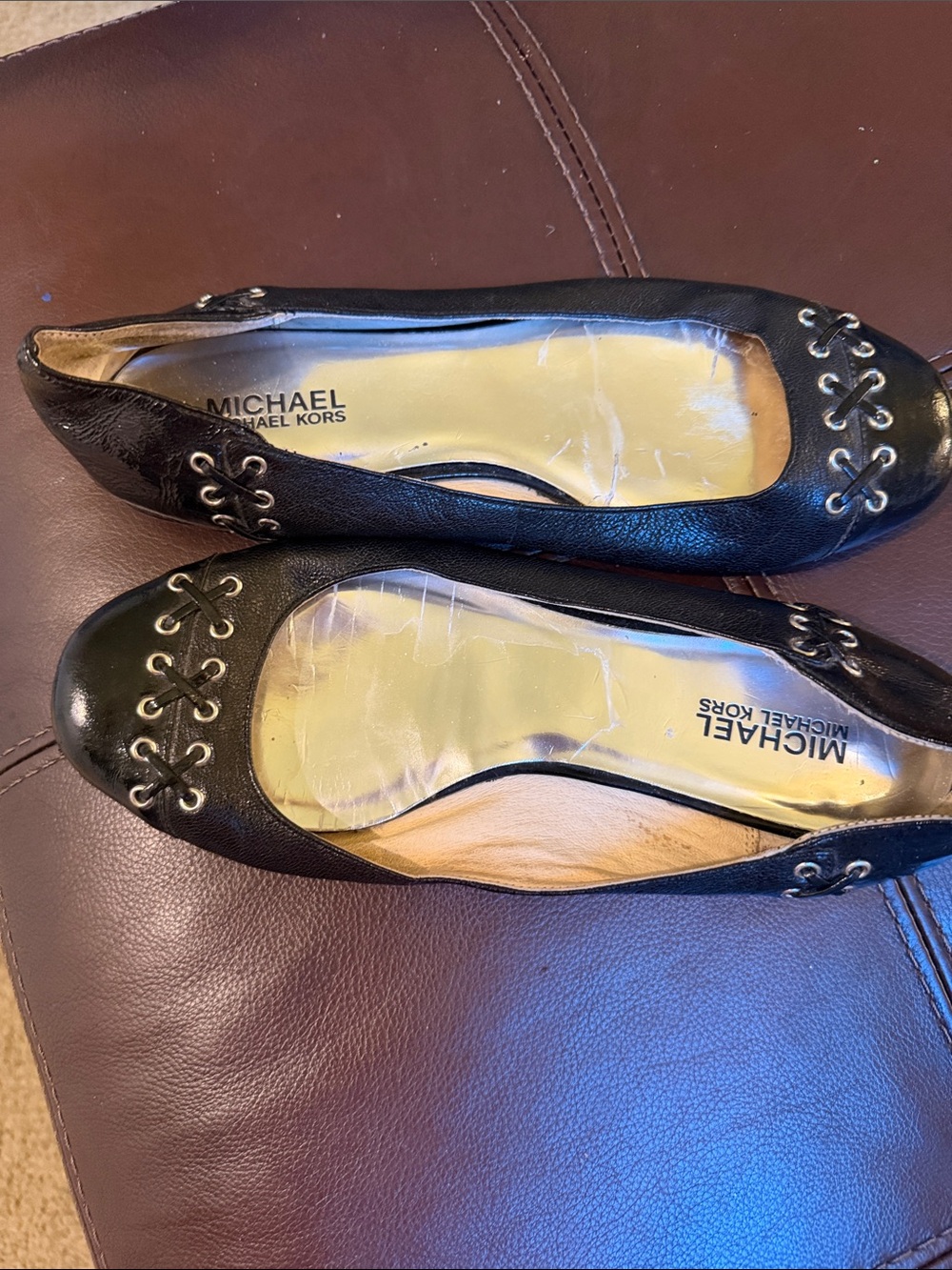 Micheal Kors black flats with grommet /leather detail sz 9.5